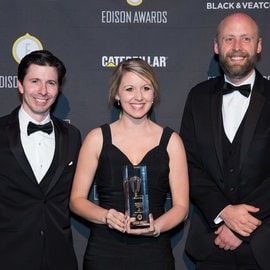 two men and a lady wining Edison Awards